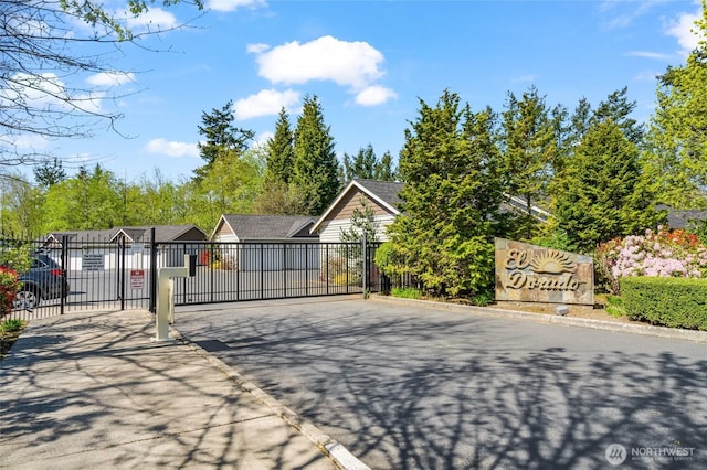 view of gate with fence