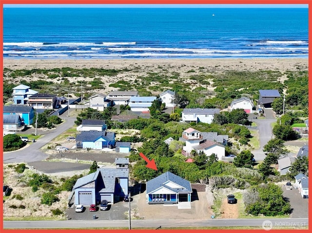birds eye view of property featuring a water view and a residential view