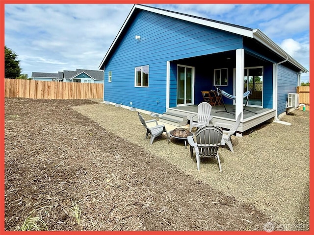 923 Ocean Shores Blvd SW, Ocean Shores, WA 98569 - back of property with a fire pit and a wooden deck