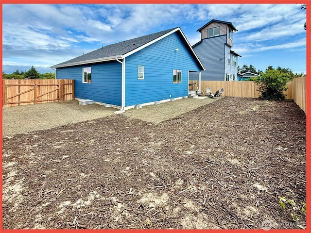 923 Ocean Shores Blvd SW, Ocean Shores, WA 98569 - rear view of property with a fenced backyard and roof with shingles