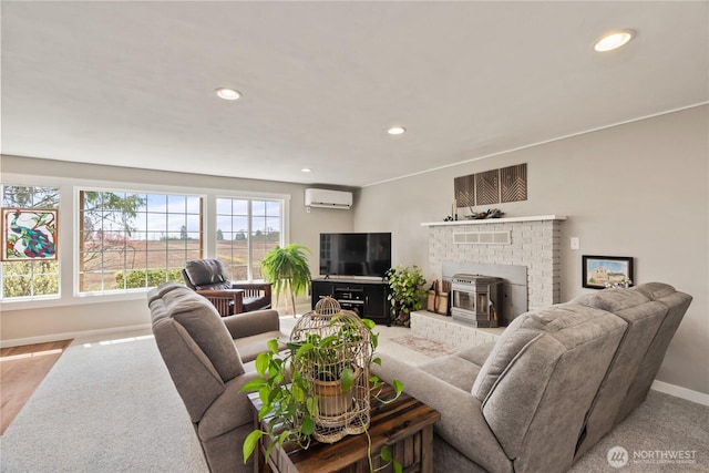 91 Hogan Rd, Hoquiam, WA 98550 - living area with recessed lighting, a wall mounted AC, a fireplace, and baseboards