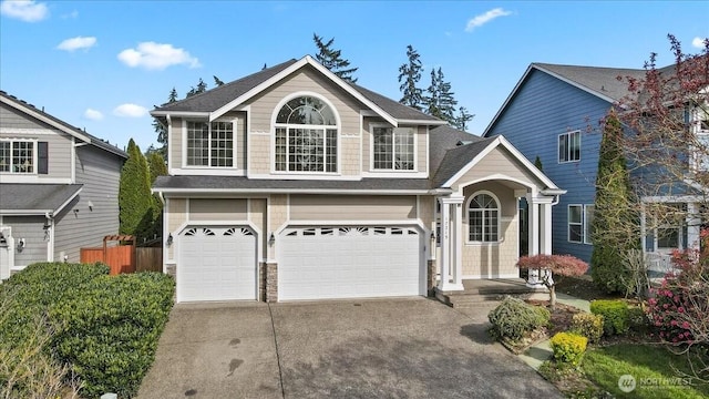17215 18th Ave E, Spanaway, WA 98387 - view of front of house featuring roof with shingles, concrete driveway, an attached garage, and fence