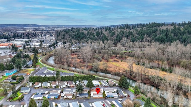 aerial view of property's location with a forest