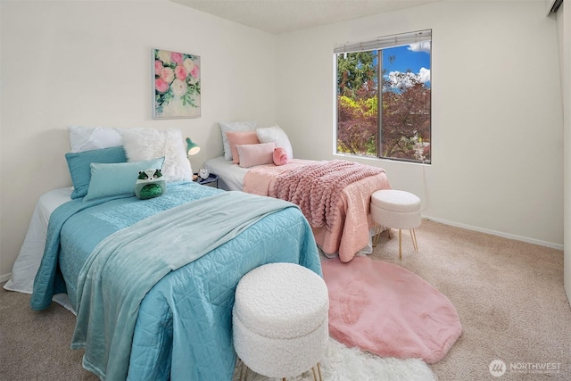 bedroom with carpet and baseboards