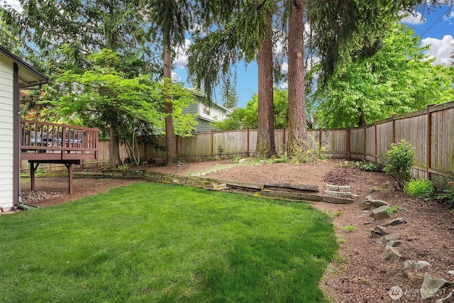 view of yard with a wooden deck