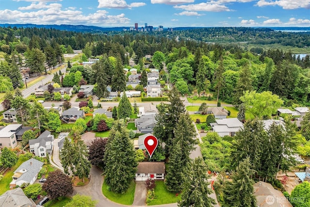 aerial view of residential area featuring a heavily wooded area