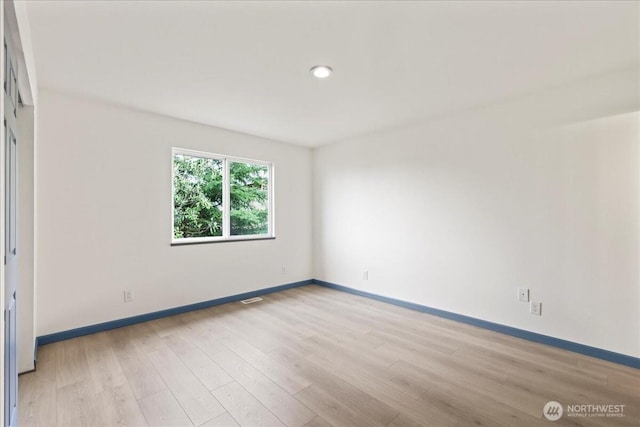 9360 SE Southworth Dr, Port Orchard, WA 98366 - empty room with light wood finished floors, baseboards, and visible vents