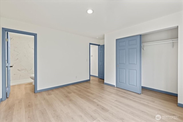 9360 SE Southworth Dr, Port Orchard, WA 98366 - unfurnished bedroom featuring a closet, light wood-style floors, baseboards, and ensuite bathroom