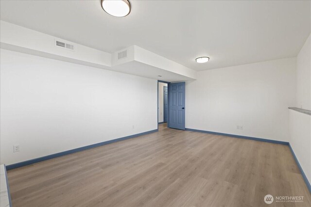9360 SE Southworth Dr, Port Orchard, WA 98366 - spare room with visible vents, baseboards, and light wood-type flooring
