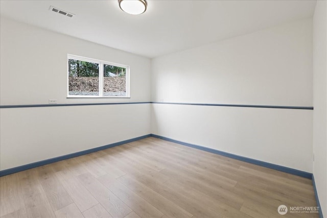 9360 SE Southworth Dr, Port Orchard, WA 98366 - spare room featuring visible vents, baseboards, and wood finished floors