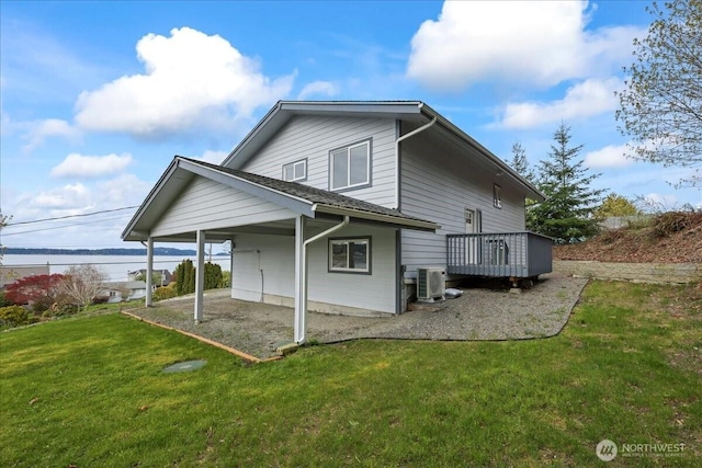 9360 SE Southworth Dr, Port Orchard, WA 98366 - rear view of property featuring a yard, central AC unit, and a carport
