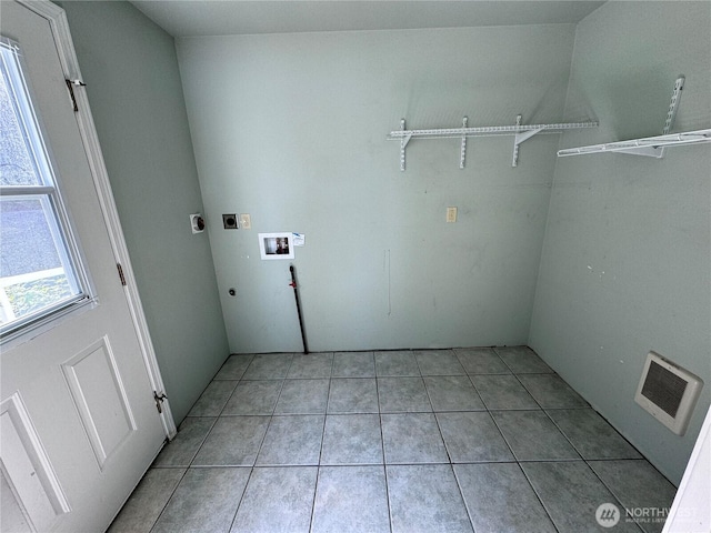 218 Pass View Rd, Decatur Island, WA 98221 - clothes washing area featuring electric dryer hookup, hookup for a washing machine, and light tile patterned flooring