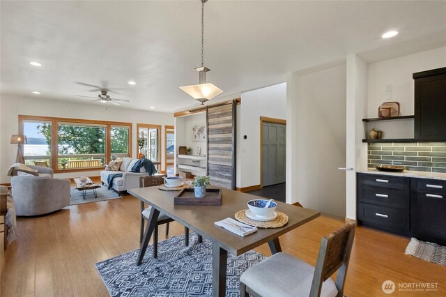 8996 Dearborn Ave, Blaine, WA 98230 - dining room with light wood finished floors, a ceiling fan, and recessed lighting