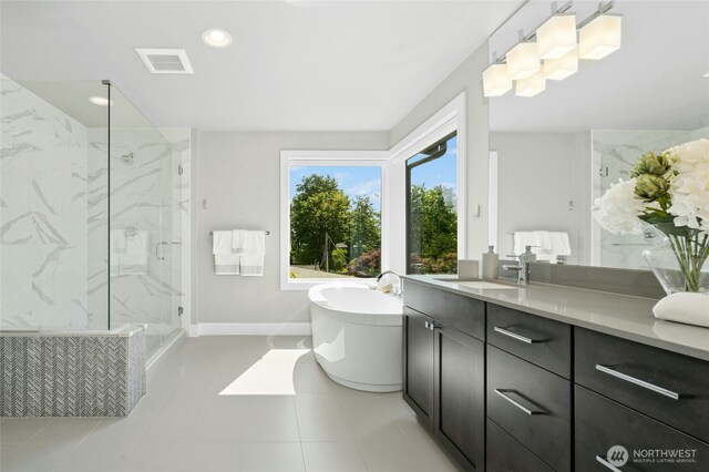 10284 133rd Ct NE, Redmond, WA 98033 - bathroom featuring a marble finish shower, a freestanding tub, vanity, baseboards, and recessed lighting