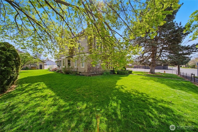 view of yard featuring fence