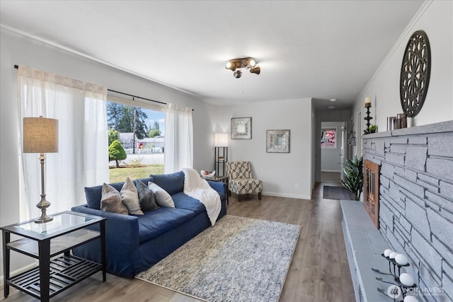 626 Legion Dr, Everett, WA 98201 - living area featuring wood finished floors, a fireplace, baseboards, and crown molding