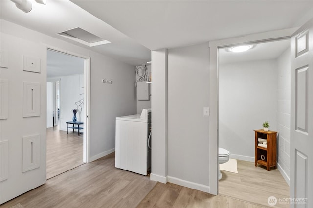 626 Legion Dr, Everett, WA 98201 - laundry room with washer / dryer, light wood finished floors, and baseboards