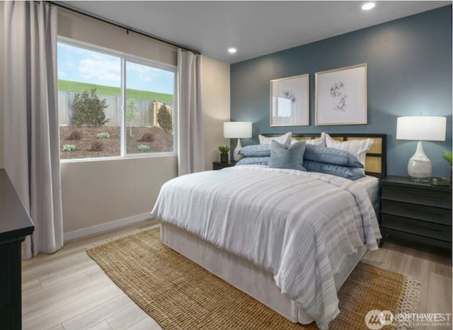 bedroom with baseboards, light wood-type flooring, and recessed lighting