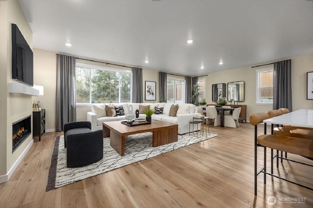 450 185th Street Ct E Unit 22, Spanaway, WA 98387 - living room with recessed lighting, a fireplace, and light wood-style flooring