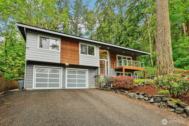 320 SW Forest Dr, Issaquah, WA 98027 - raised ranch featuring driveway, stairs, and an attached garage