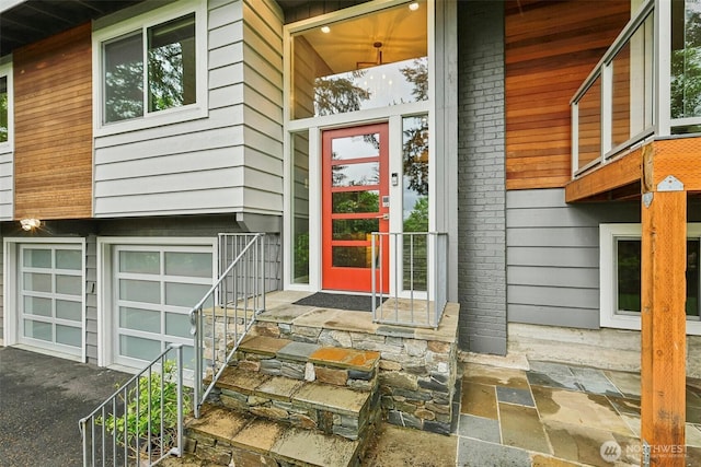 320 SW Forest Dr, Issaquah, WA 98027 - entrance to property featuring an attached garage and asphalt driveway