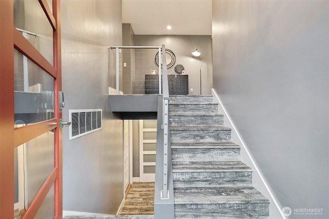 320 SW Forest Dr, Issaquah, WA 98027 - stairway featuring wood finished floors