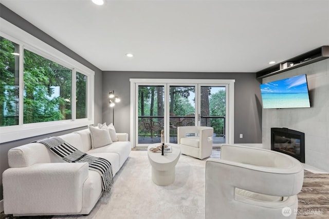 320 SW Forest Dr, Issaquah, WA 98027 - living room with a tiled fireplace, recessed lighting, and wood finished floors