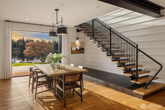 dining area with stairway, recessed lighting, and wood finished floors