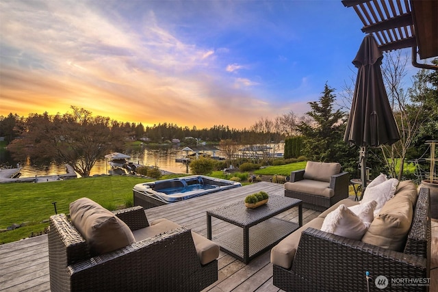 deck with a lawn, a water view, an outdoor living space, and hot tub deck surround