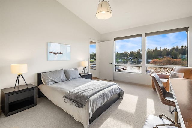 bedroom featuring light colored carpet and lofted ceiling