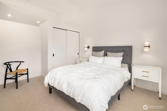 bedroom featuring carpet, a closet, and recessed lighting