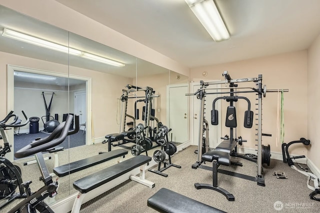 gym featuring baseboards