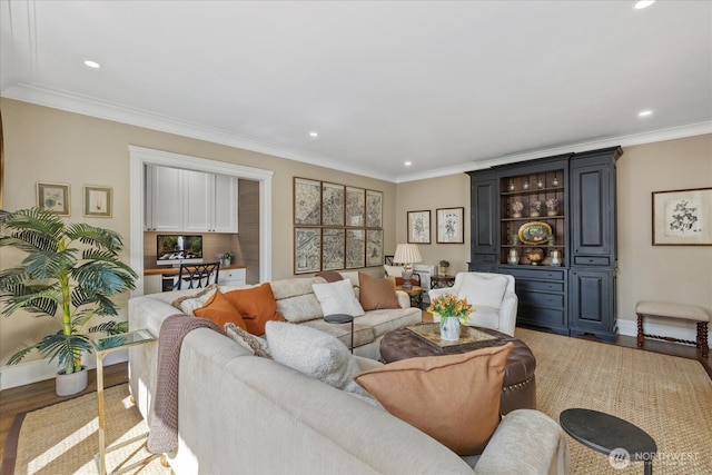 living room featuring ornamental molding, wood finished floors, and recessed lighting