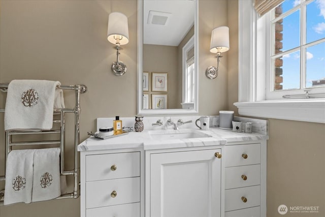 bathroom featuring visible vents and vanity