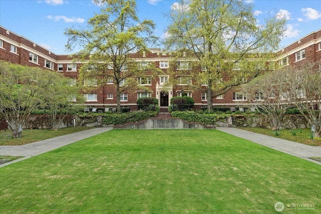 view of home's community featuring a yard