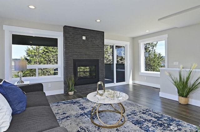 8536 S 114th St, Seattle, WA 98178 - living room featuring recessed lighting, a brick fireplace, baseboards, and wood finished floors