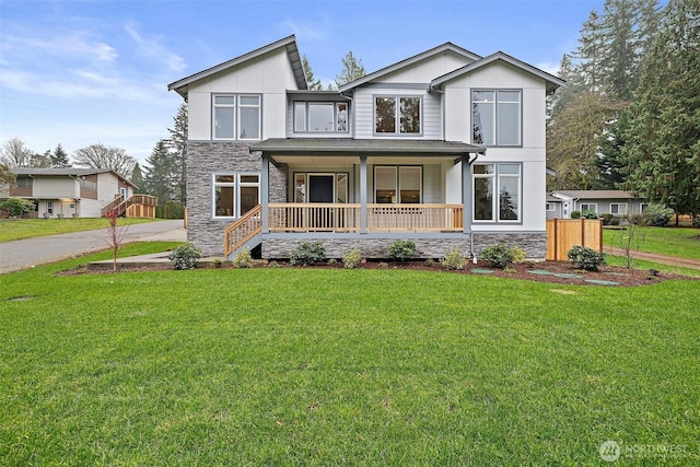 3711 S 349th Pl, Auburn, WA 98001 - view of front of house featuring a porch, stone siding, a front lawn, and board and batten siding