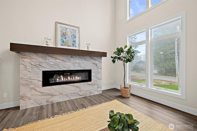 3711 S 349th Pl, Auburn, WA 98001 - unfurnished living room with wood finished floors, a fireplace, and baseboards