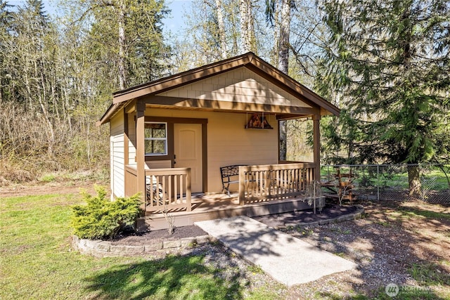 view of outbuilding with fence