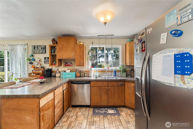 6507 Karjala Rd, Aberdeen, WA 98520 - kitchen featuring appliances with stainless steel finishes, a peninsula, a sink, plenty of natural light, and crown molding