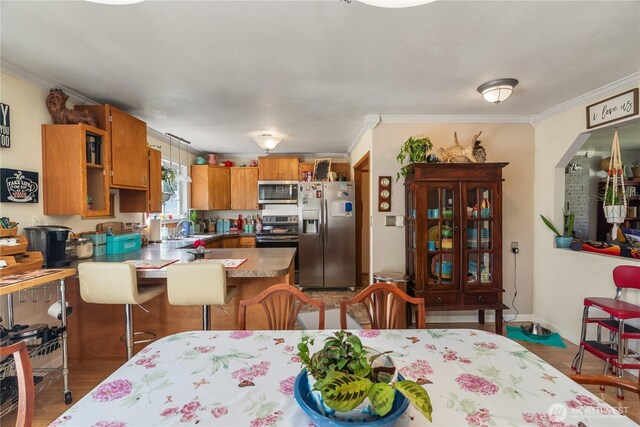 6507 Karjala Rd, Aberdeen, WA 98520 - dining room with ornamental molding and light wood-style floors