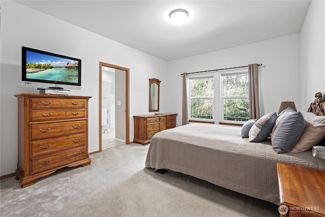 bedroom featuring baseboards and light colored carpet