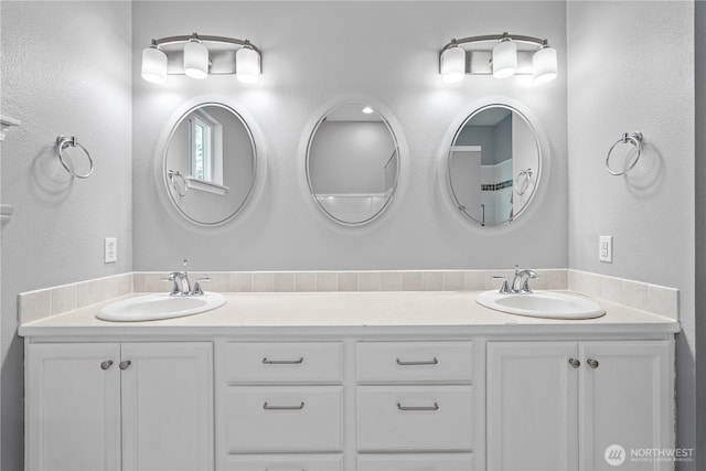 bathroom with double vanity and a sink