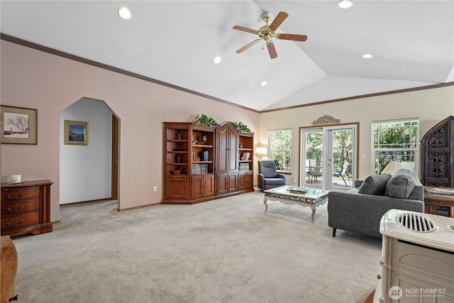living area with vaulted ceiling, ceiling fan, light colored carpet, ornamental molding, and recessed lighting