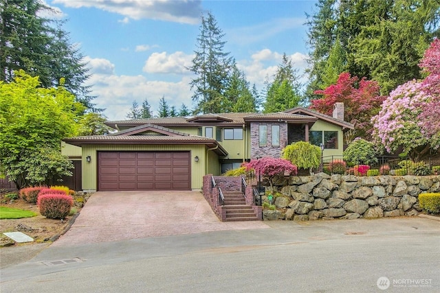 806 Alpine Dr, Everett, WA 98203 - view of front of home featuring an attached garage, concrete driveway, and a chimney