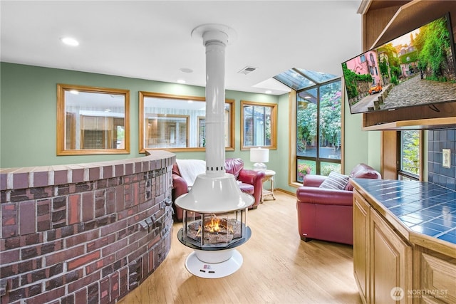 806 Alpine Dr, Everett, WA 98203 - living room featuring decorative columns, light wood finished floors, baseboards, and recessed lighting