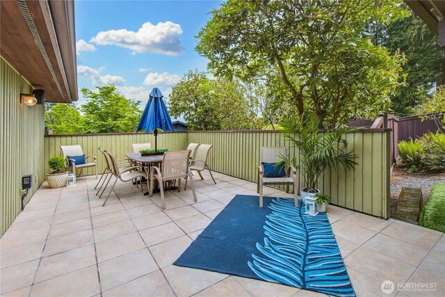 806 Alpine Dr, Everett, WA 98203 - view of patio featuring outdoor dining area and fence