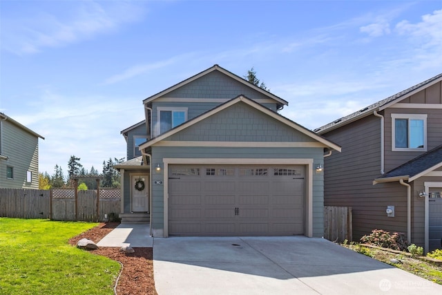 382 NE Ohenry Ct, Poulsbo, WA 98370 - view of front facade featuring fence, driveway, a front yard, and a garage