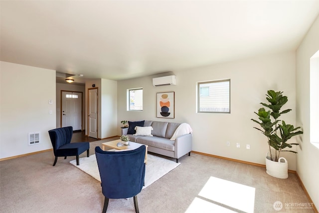 382 NE Ohenry Ct, Poulsbo, WA 98370 - living room featuring visible vents, light carpet, baseboards, and a wall mounted air conditioner