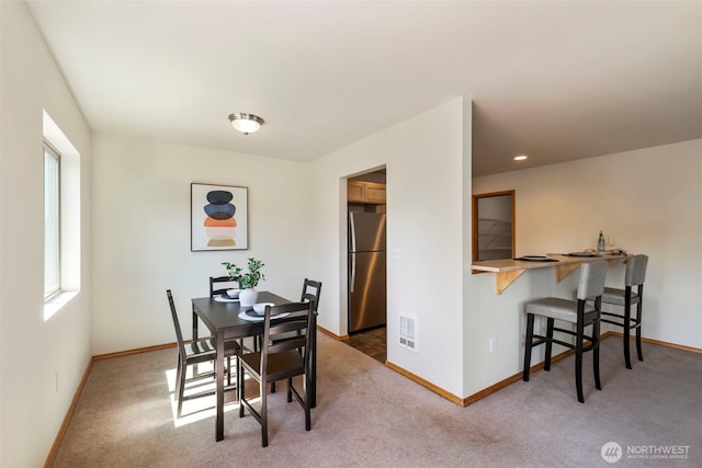 382 NE Ohenry Ct, Poulsbo, WA 98370 - dining area featuring light colored carpet, baseboards, visible vents, and recessed lighting